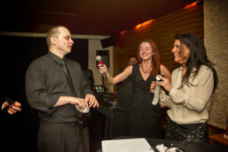 Corporate magicians reading minds during a sales seminar