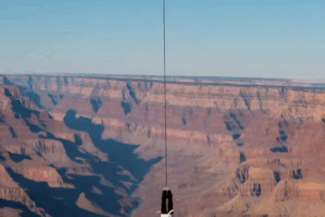 Upside down straight jacket escape over Grand Canyon